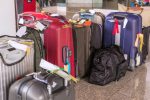 Luggage consisting of large suitcases rucksacks and travel bag.